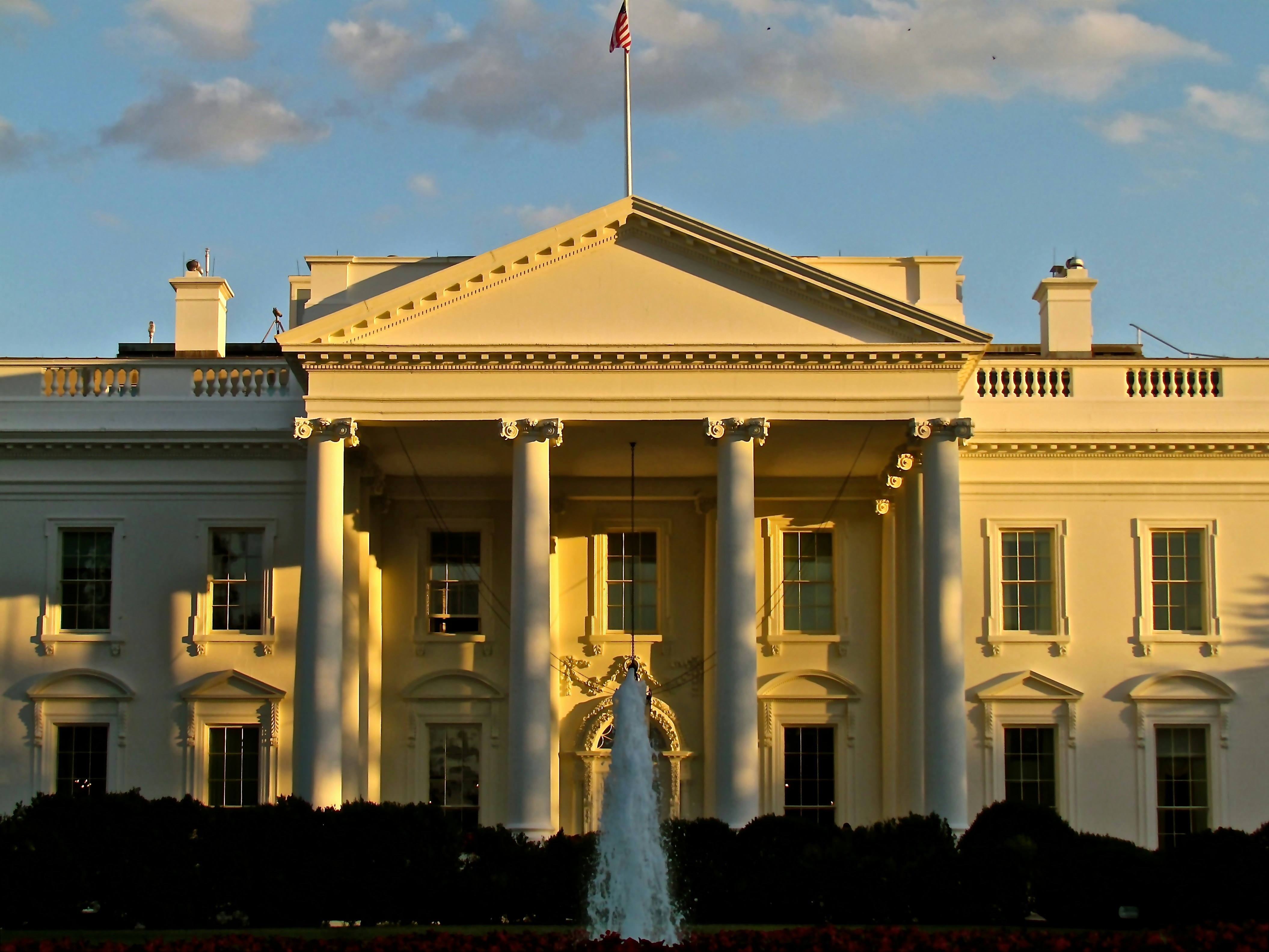 The White House north facade at golden hour with fountain in foreground